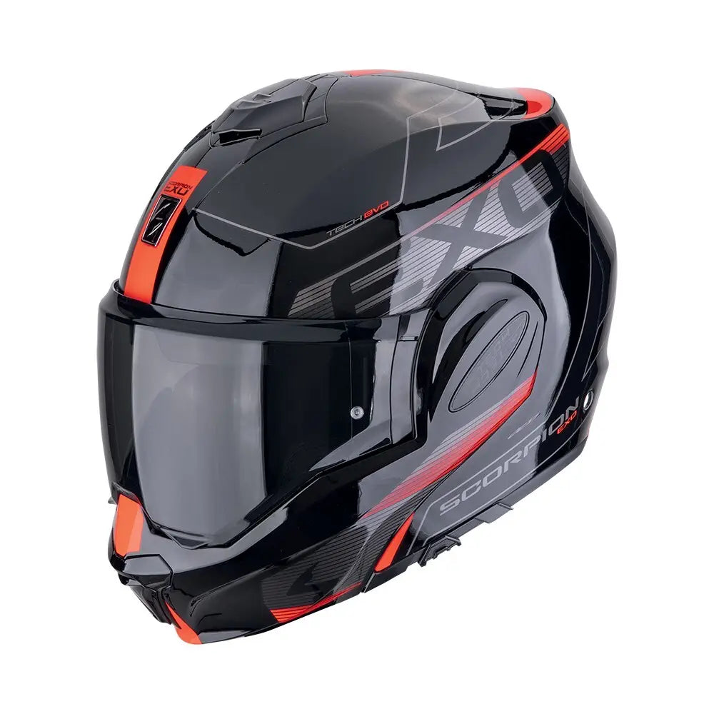Een modulaire motorhelm in zwart en rood, de Scorpion Exo-Tech Evo Traveller, ontworpen voor veelzijdigheid en comfort op lange ritten.